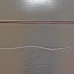 Closeup photo of barbed facial threads and cannula for threadlift