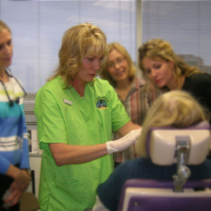 Dr. Elliott at Skinspirations, demonstrating esthetic injectable treatment during class.