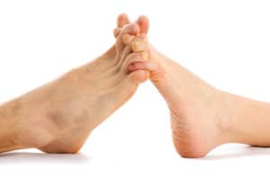Man & woman's toes intertwined