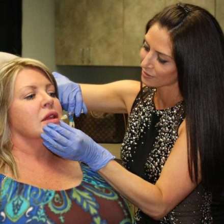 Our APRN, Kate Dellangelo, injects a patient's lips during a demonstration.